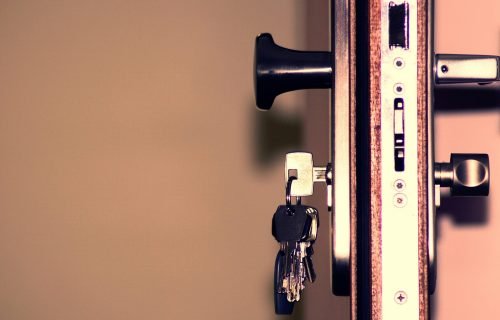 Detailed view of a door lock and keys emphasizing security and access.